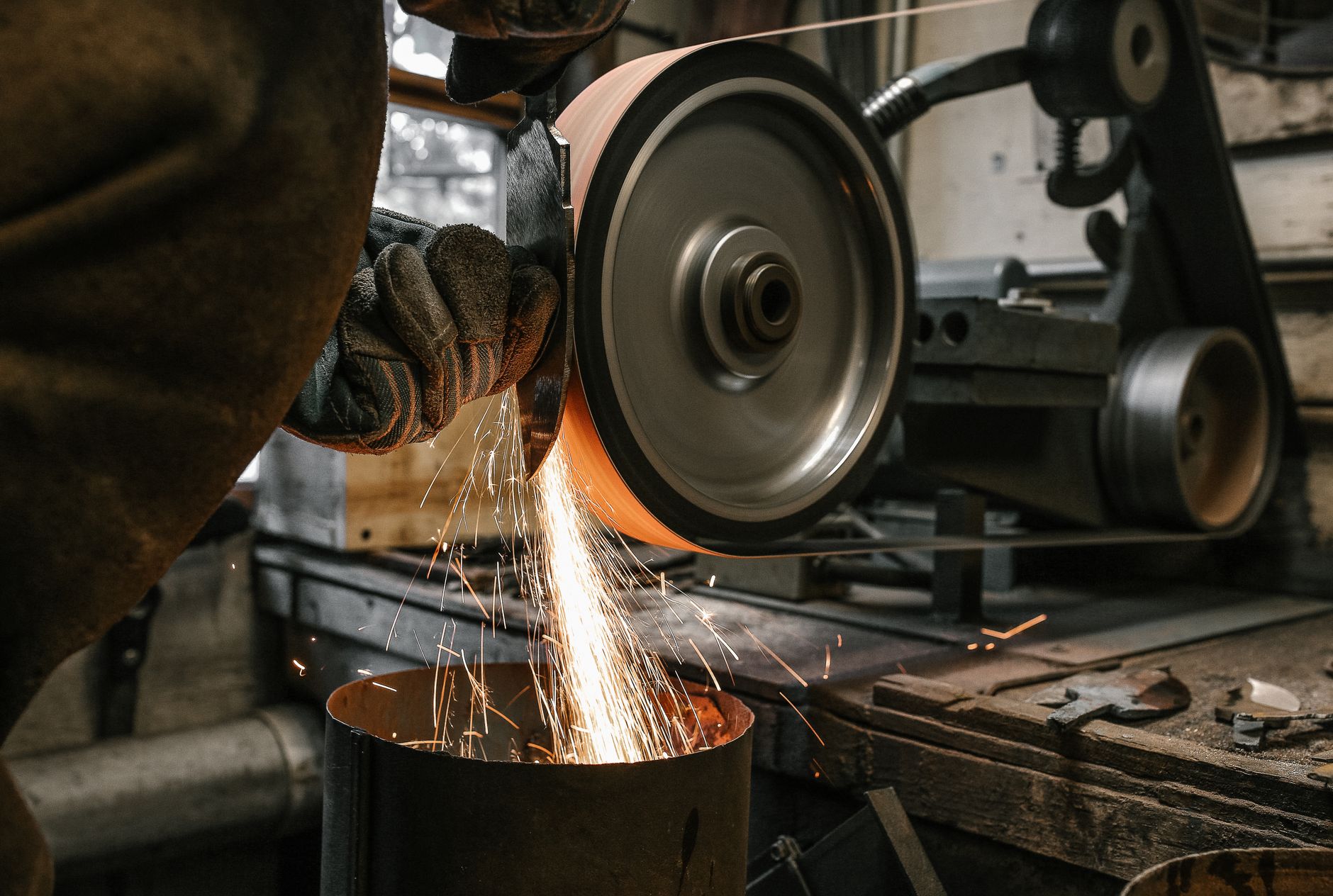 Metal fabrication and grinding work in a restoration workshop